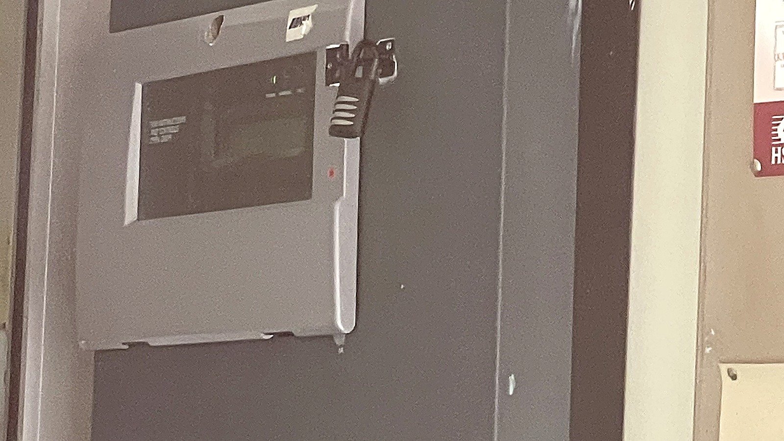 Fire alarm control panel with visible cabling